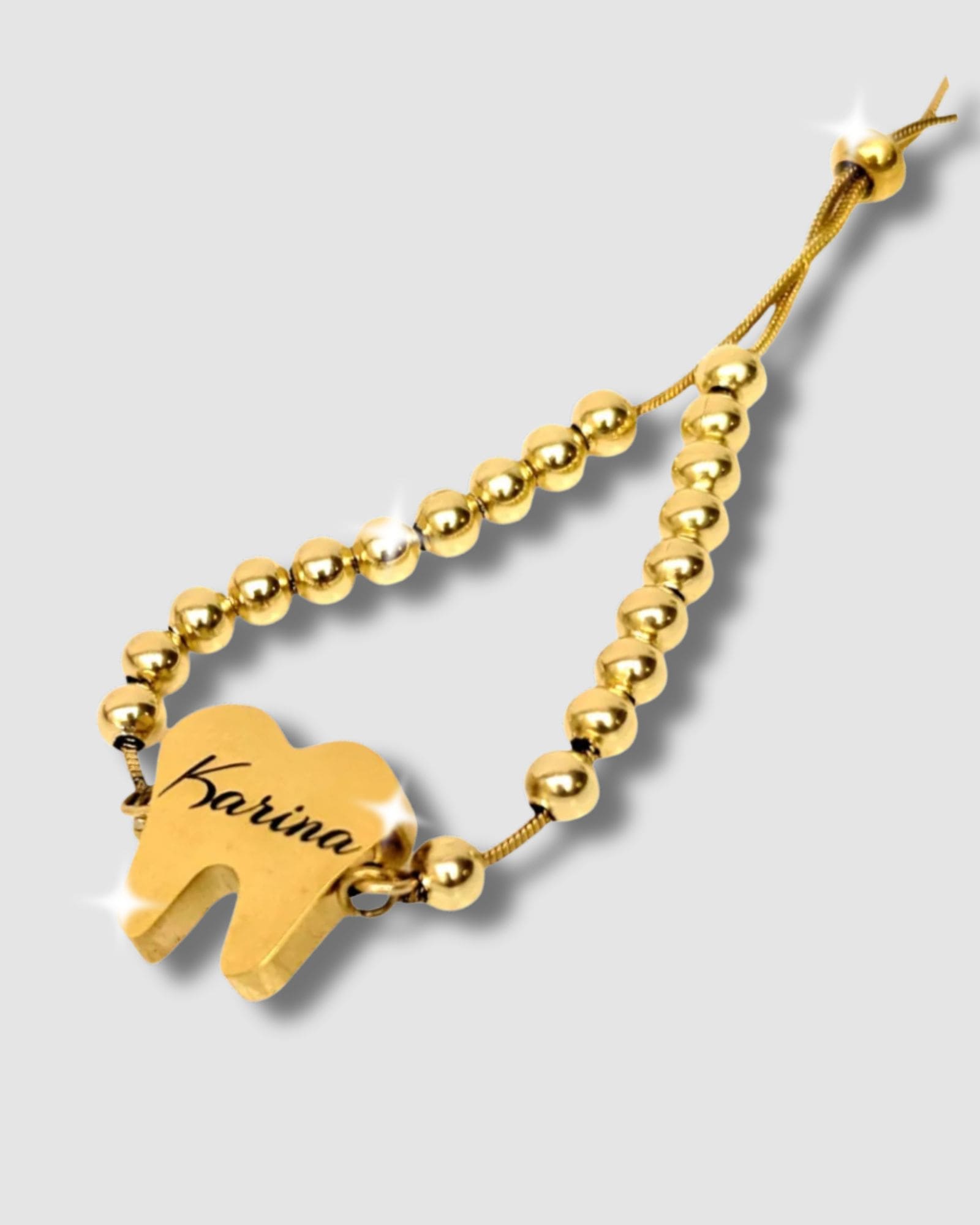 Pulsera en forma de diente con mensaje