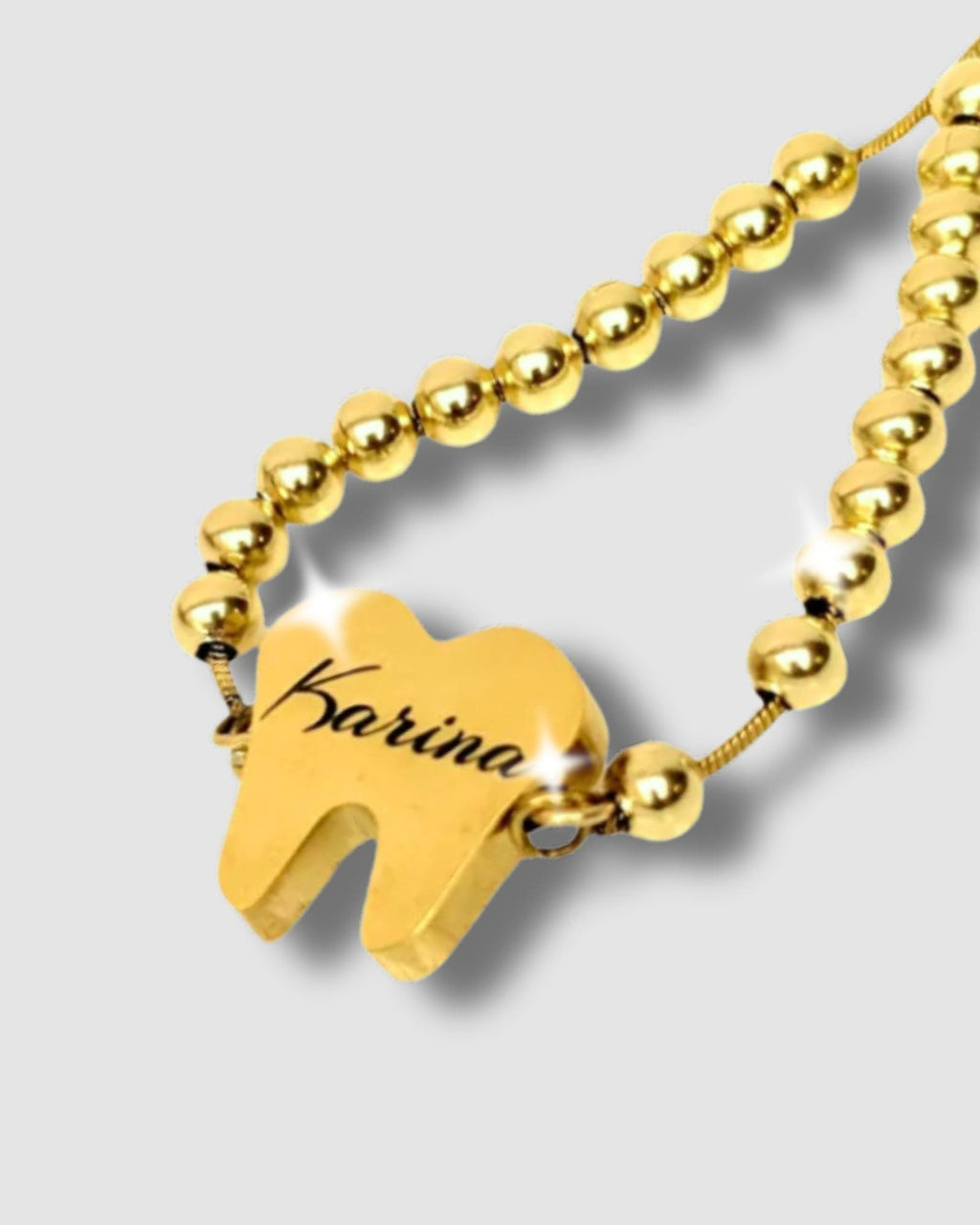 Pulsera en forma de diente con mensaje