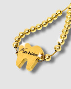Pulsera en forma de diente con mensaje