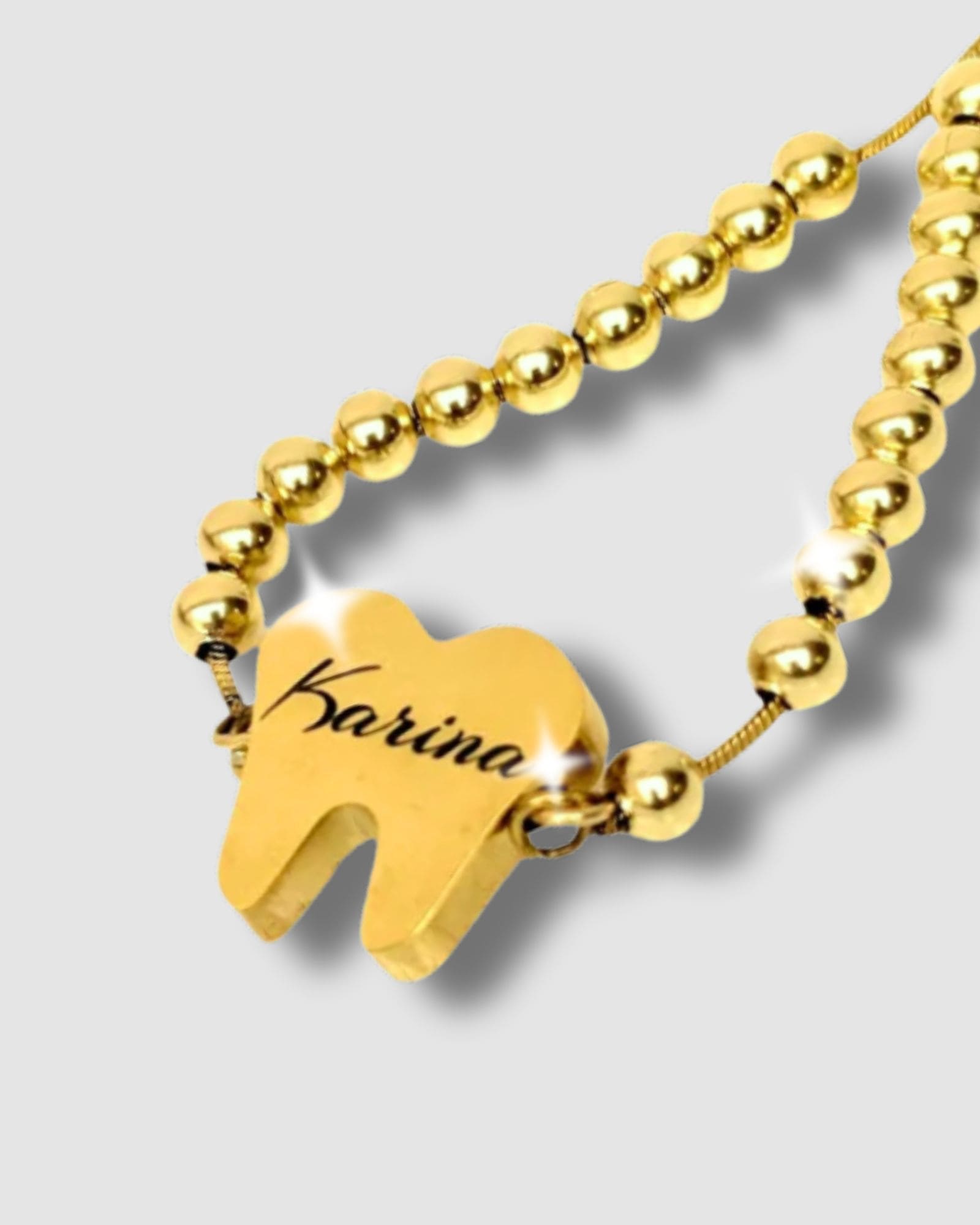 Pulsera en forma de diente con mensaje